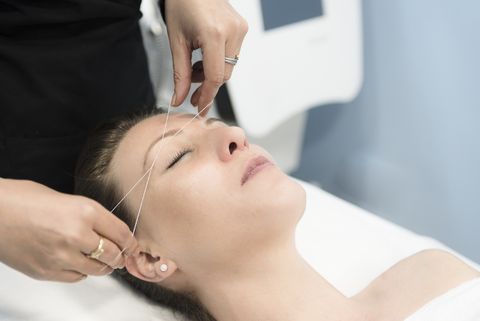 woman-removing-facial-hair-royalty-free-image-951879062-1549661216